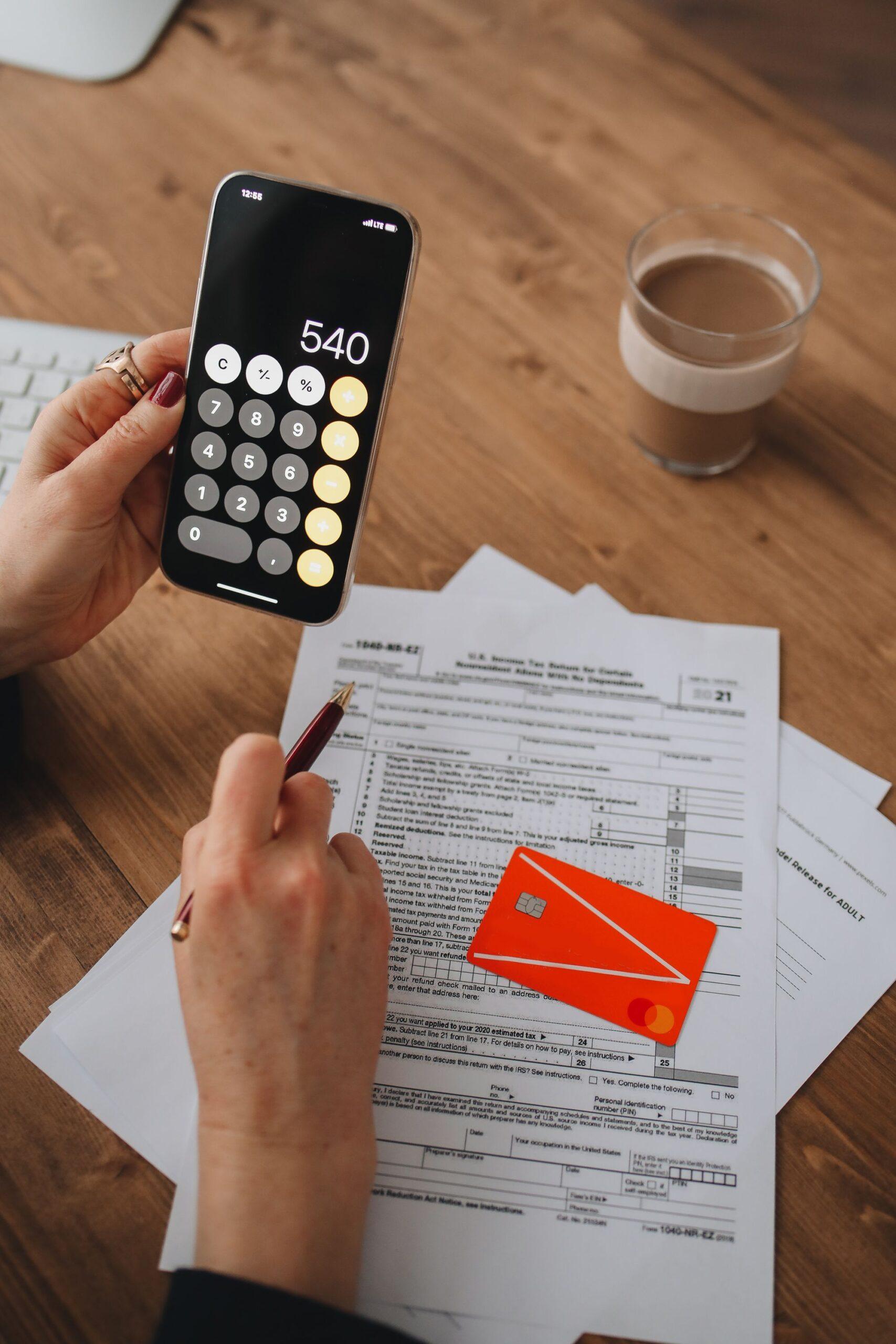 IRS CP53E notice refund status checked on a phone beside tax documents