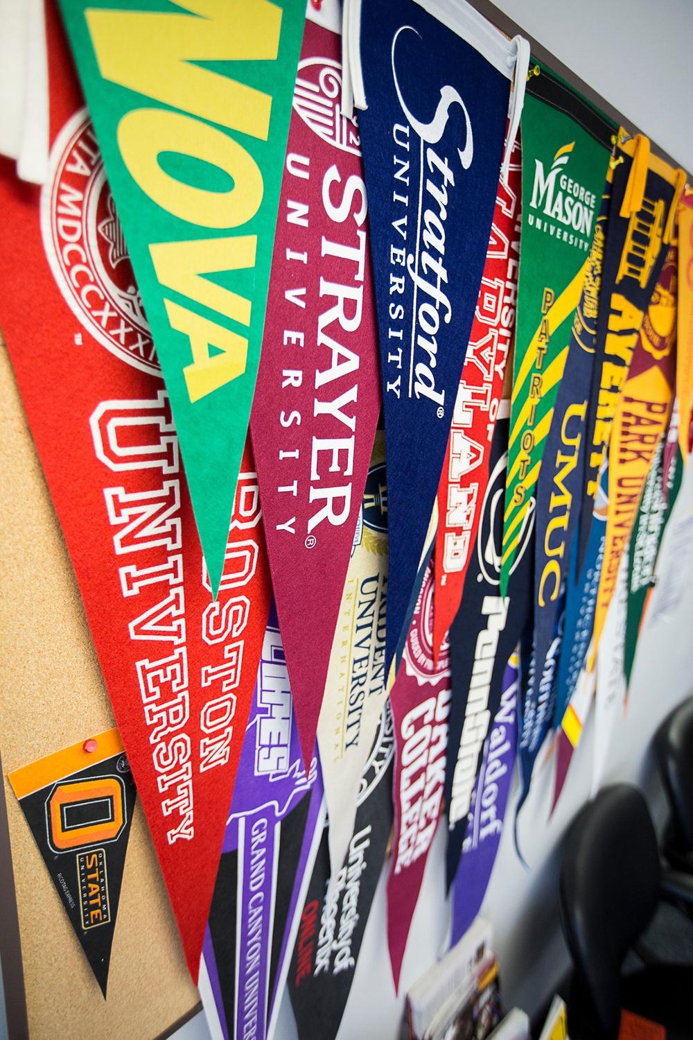 Post 9/11 GI Bill rates shown by university pennants in a military education office